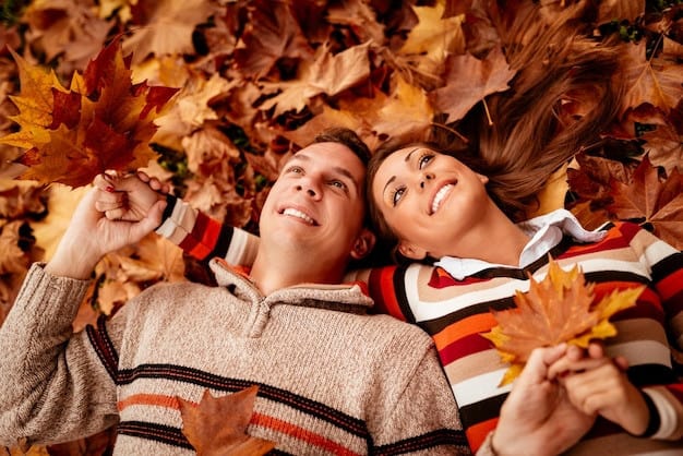 Romantic Things To Do In Grand Rapids, Michigan : Couple laying on fall leaves - Credits: Freepik